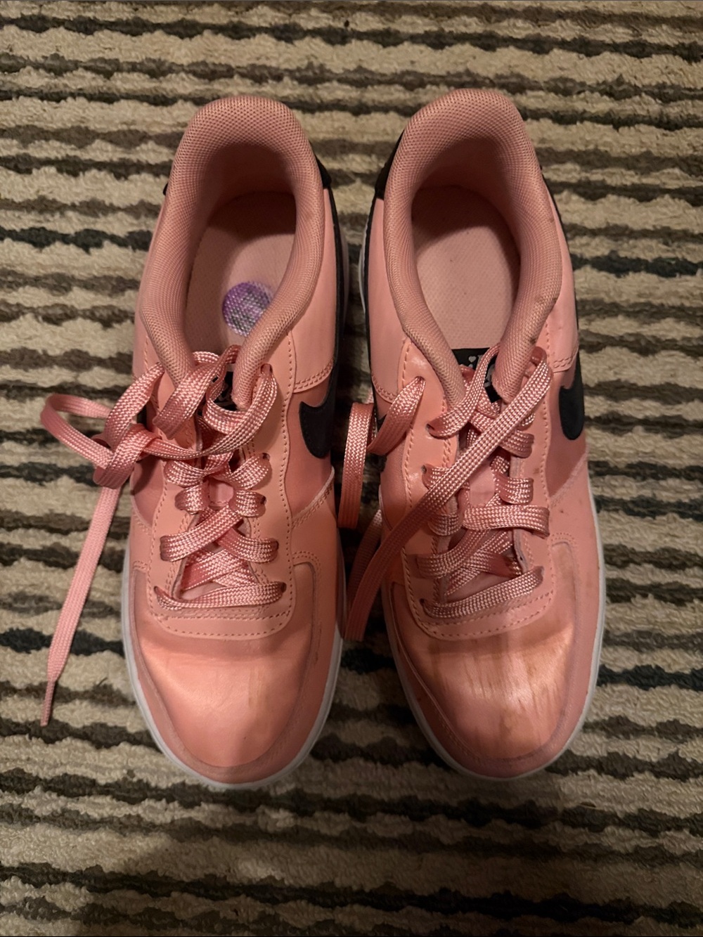 Nike Pink Low-Top Sneakers with Black Swoosh